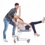 man-shopping-his-wife-trolley-handsome-young-men-going-out-to-shop-pushing-carefree-laughing-along-cart-as-have-46896329